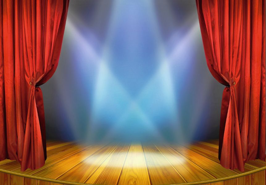 Theater stage with red curtains and spotlights